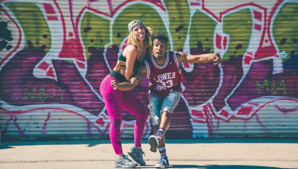 man beside a woman taking a photo